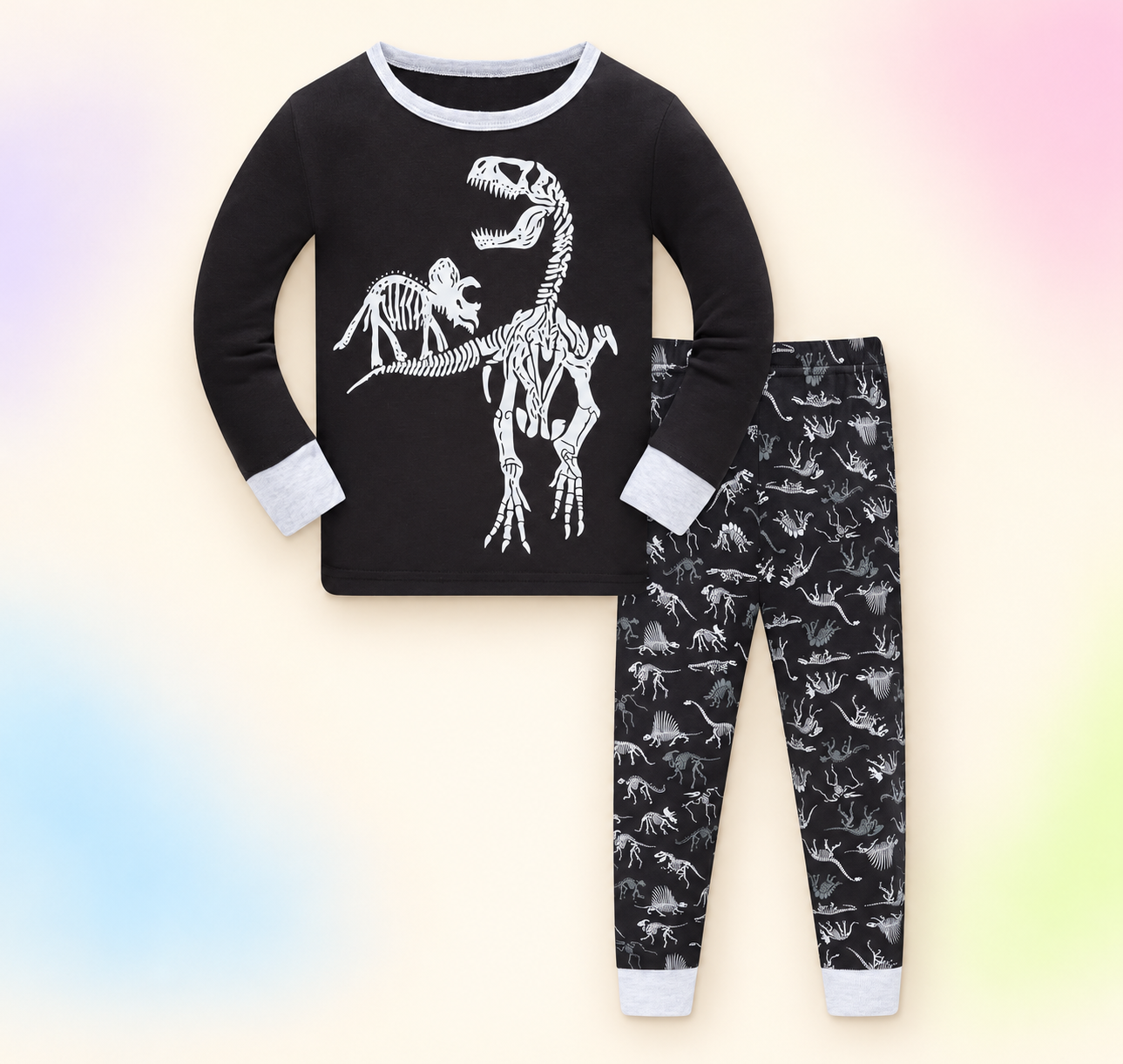 Black and white pajama set on a soft pastel branded studio background.